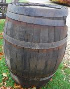 An iron-bound coopered oak barrel,