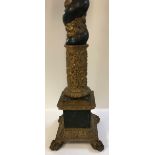 A pair of carved giltwood and gesso and verdigris patinated altar sticks in the Renaissance manner,