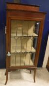 An Edwardian mahogany and leaded glazed single door display cabinet on square splayed supports,