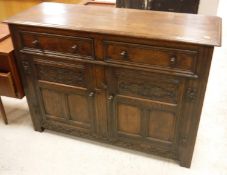 A modern oak dresser in the 17th Century style,