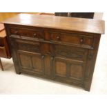 A modern oak dresser in the 17th Century style,