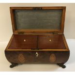 A Regency burr yew and marquetry inlaid tea caddy with brass ring handles,