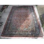 A Persian silk carpet,