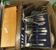 A box of assorted plated and other metal wares to include cutlery, tureens, toast rack,