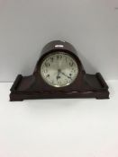 An early 20th Century mahogany cased dome top mantel clock with silvered dial and Arabic numerals