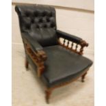 A Victorian buttoned upholstered walnut framed reclining armchair with galleried arm rails and