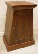 A modern mahogany urn stand or pot cupboard of tapering form with single door enclosing single