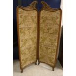 A circa 1900 French walnut and carved two fold screen with silk panels in the Louis XV taste,