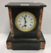 A late 19th Century French black marble and rosso marble cased mantel clock,