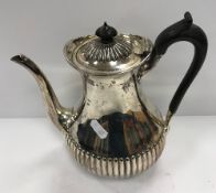 A Victorian silver coffee pot of pear form with semi-reeded decoration (by Martin Hall & Co,