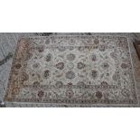 A Ziegler designed rug, the central panel set with all over foliate design on a cream ground approx.