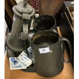 WITHDRAWN A pewter flagon, two twin-handled pewter loving mugs and a charger,