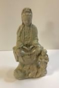 WITHDRAWN A Chinese blanc de chine figure of Guan Yin with attendant,