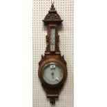 A circa 1900 carved oak framed aneroid barometer thermometer 78 cm high