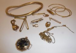 A collection of various gold jewellery to include snake style necklace, brooch inscribed "N.M.H.
