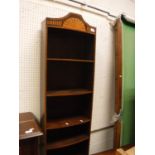 An Edwardian Sheraton Revival bookcase cabinet of slim proportions,
