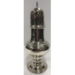 A Chester silver baluster shaped sugar caster of typical form raised on a circular foot (loaded)