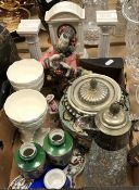 A collection of various china wares to include a Beleek mantel clock with clover decoration and