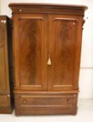 A Victorian figured mahogany wardrobe,