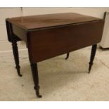 A Victorian mahogany rounded rectangular drop-leaf Pembroke table with single end drawer,
