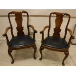 A pair of early 20th Century walnut carver chairs in the early 18th Century manner with vase shaped