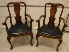 A pair of early 20th Century walnut carver chairs in the early 18th Century manner with vase shaped