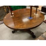 An early Victorian rosewood breakfast table, the circular snap top with plain frieze,