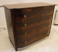 A Regency mahogany bow fronted chest of four long drawers, flanked by moulded side pilasters,