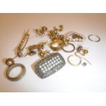 A collection of various jewellery to include un-marked yellow metal rings x 3,