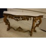 A 19th Century carved giltwood and gesso framed console table of serpentine form,