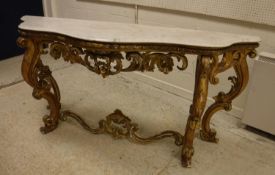 A 19th Century carved giltwood and gesso framed console table of serpentine form,