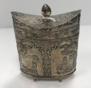 A circa 1900 Continental embossed silver lidded box of navette form with all-over figural panel