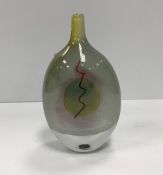 A Siddy Langley bottle shaped vase with red wiggle stripe and egg type decoration,