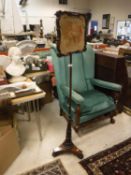 An early Victorian mahogany framed pole screen,