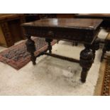 A late Victorian carved oak centre table in the Gothic Revival taste,