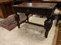 A late Victorian carved oak centre table in the Gothic Revival taste,