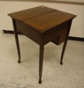 An Edwardian mahogany and inlaid writing table,