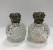 A pair of silver mounted hobnail cut glass grenade scent bottles 11.