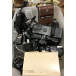 A box containing a collection of various vintage and other cameras including Polaroid Land camera