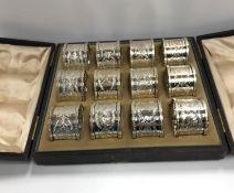 A set of twelve Victorian silver and engraved napkin rings,