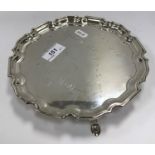 A Mappin & Webb silver salver with pie crust rim in the Georgian style bearing various signatures