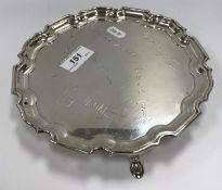 A Mappin & Webb silver salver with pie crust rim in the Georgian style bearing various signatures
