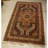 A modern Mahal rug, the central medallion on a blue and red and cream ground,