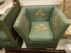 An early 20th Century green upholstered and floral spray needlework decorated knowle chair of