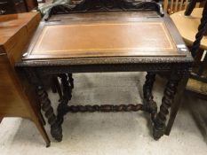 A Victorian carved oak Gothic Revival clerk's desk on barley-twist supports united by stretchers,
