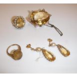 A collection of citrine jewellery including 9 carat gold mounted and seed pearl decorated oval