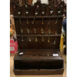 A 19th Century provincial oak spoon rack of two tiers with box and recess to base, 34.