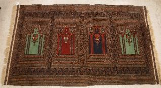 An Anatolian prayer rug, the central panel set with four repeating panels, each with Mirhab design,