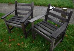 A pair of slatted teak garden elbow chairs, 68.