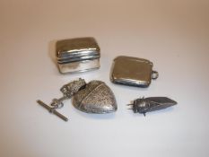 A silver pill box of rectangular form inscribed “Alice” and a silver Vesta case heart shaped silver